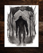 bigfoot ink painting top down on wood planks