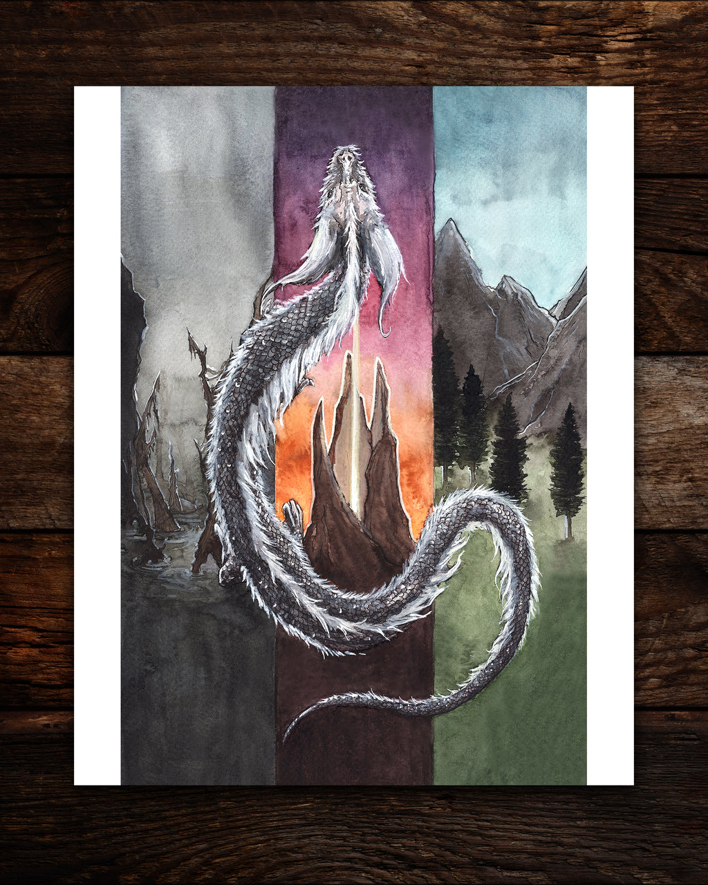 falkor dragon watercolor painting print laying flat on wood planks